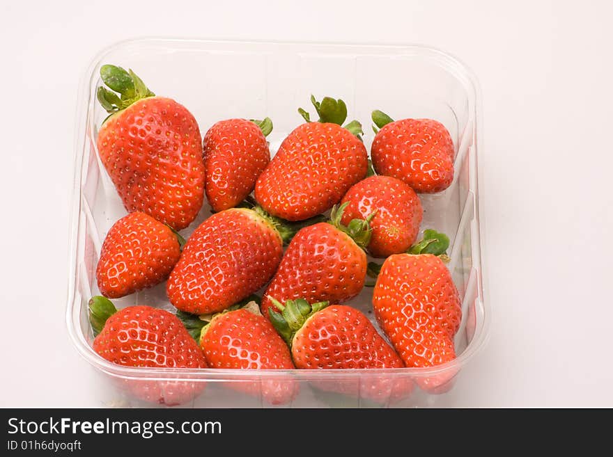 Pummet of  strawberries on a white background. Pummet of  strawberries on a white background