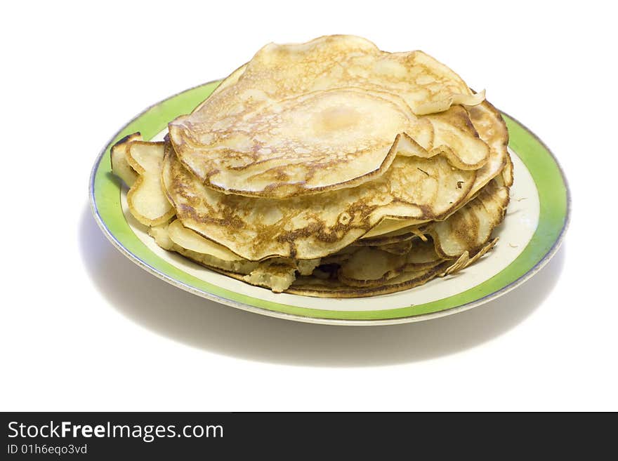 Pancakes at the plate on a white background