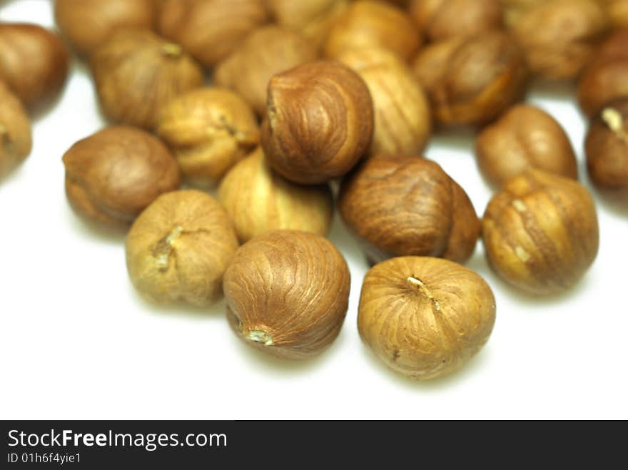 Hazelnuts on white background. Shallow DOF