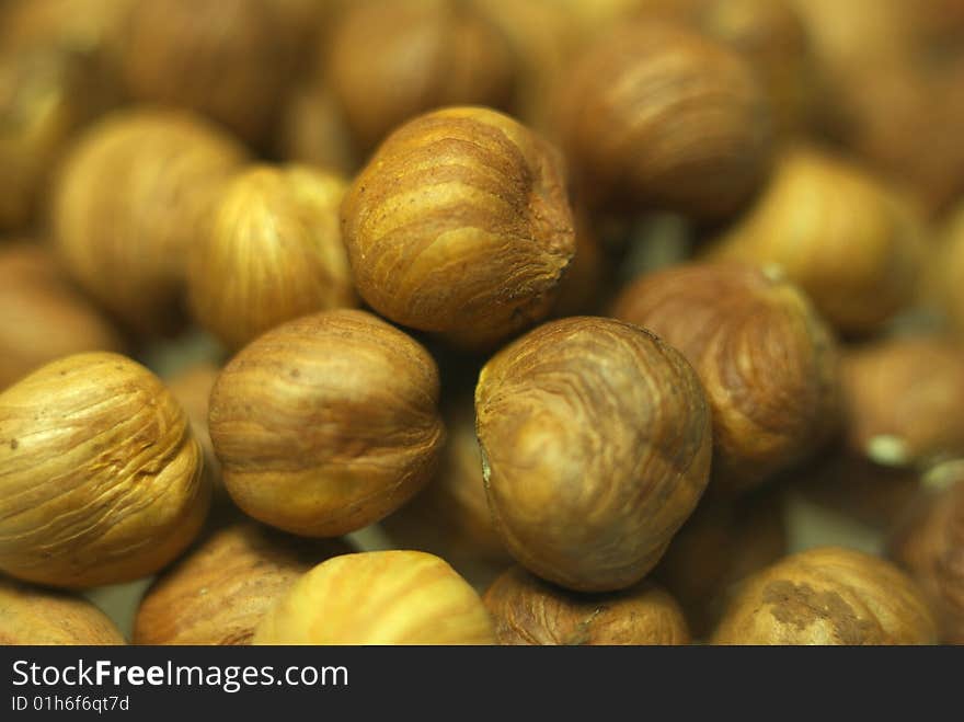 Hazelnuts background. Close up. Shallow DOF