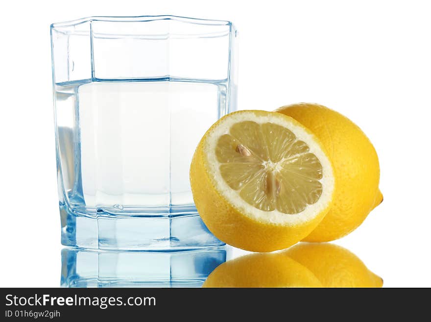 Fresh water in glass and lemons