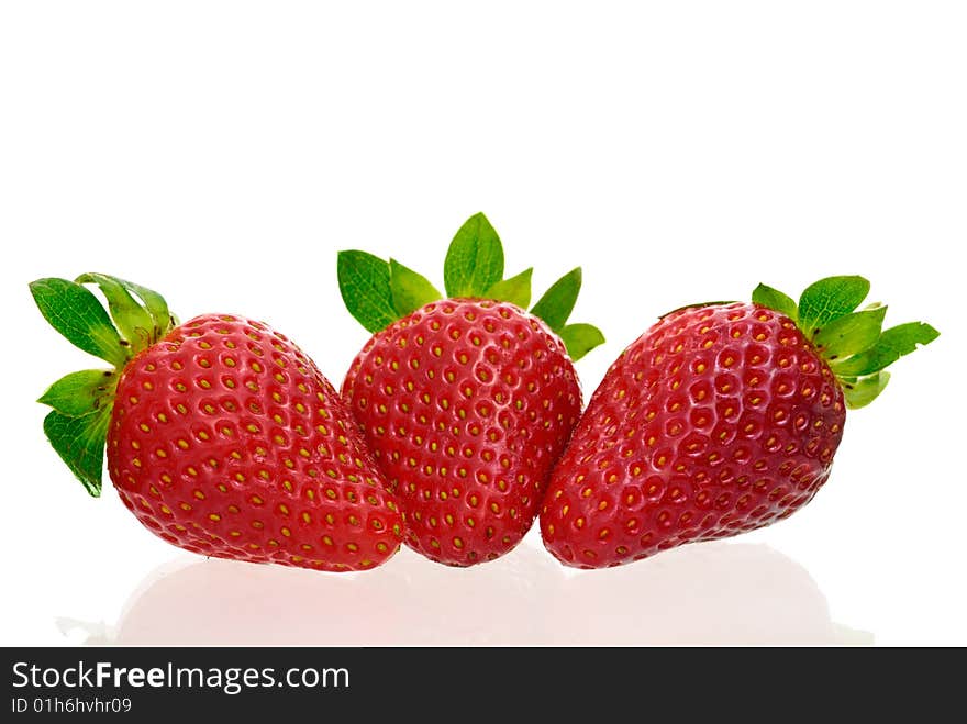 Three delicious strawberries isolated on white background with copy space.