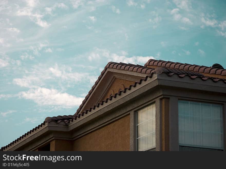 Part of a house on blue sky background