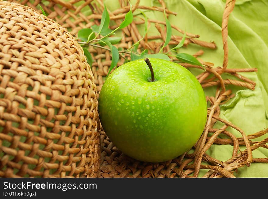 Apple and straw hat