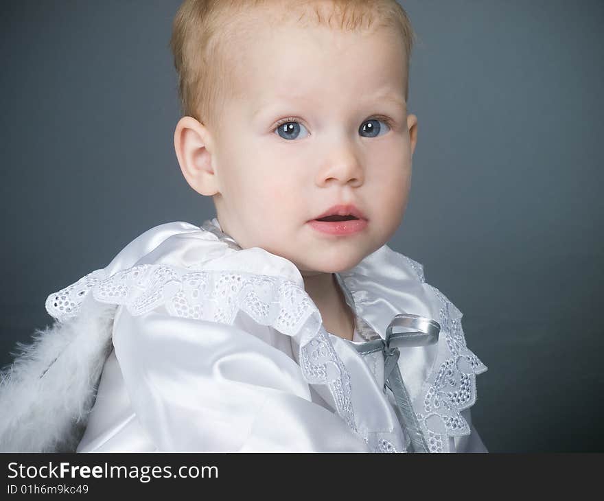 Baby angel girl with fluffy wings