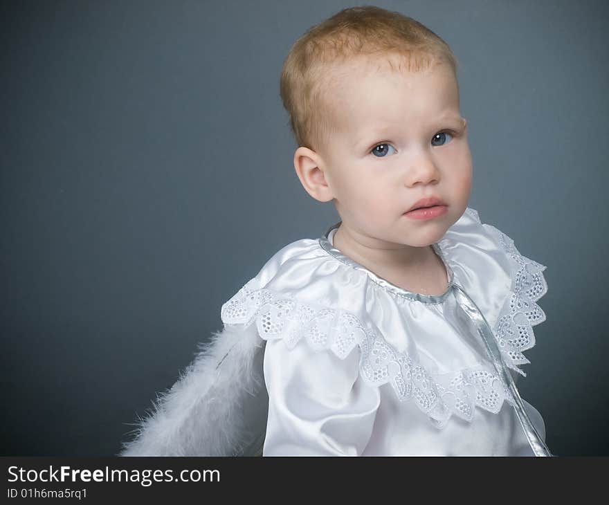 Baby angel girl with fluffy wings