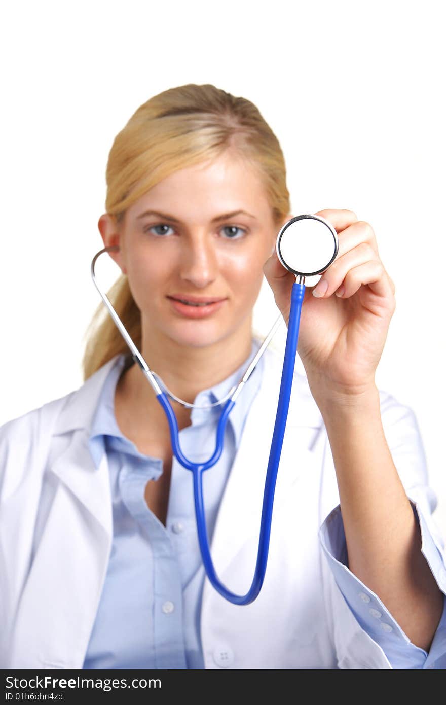 Woman Doctor Holding Stethoscope in focus isolated on white