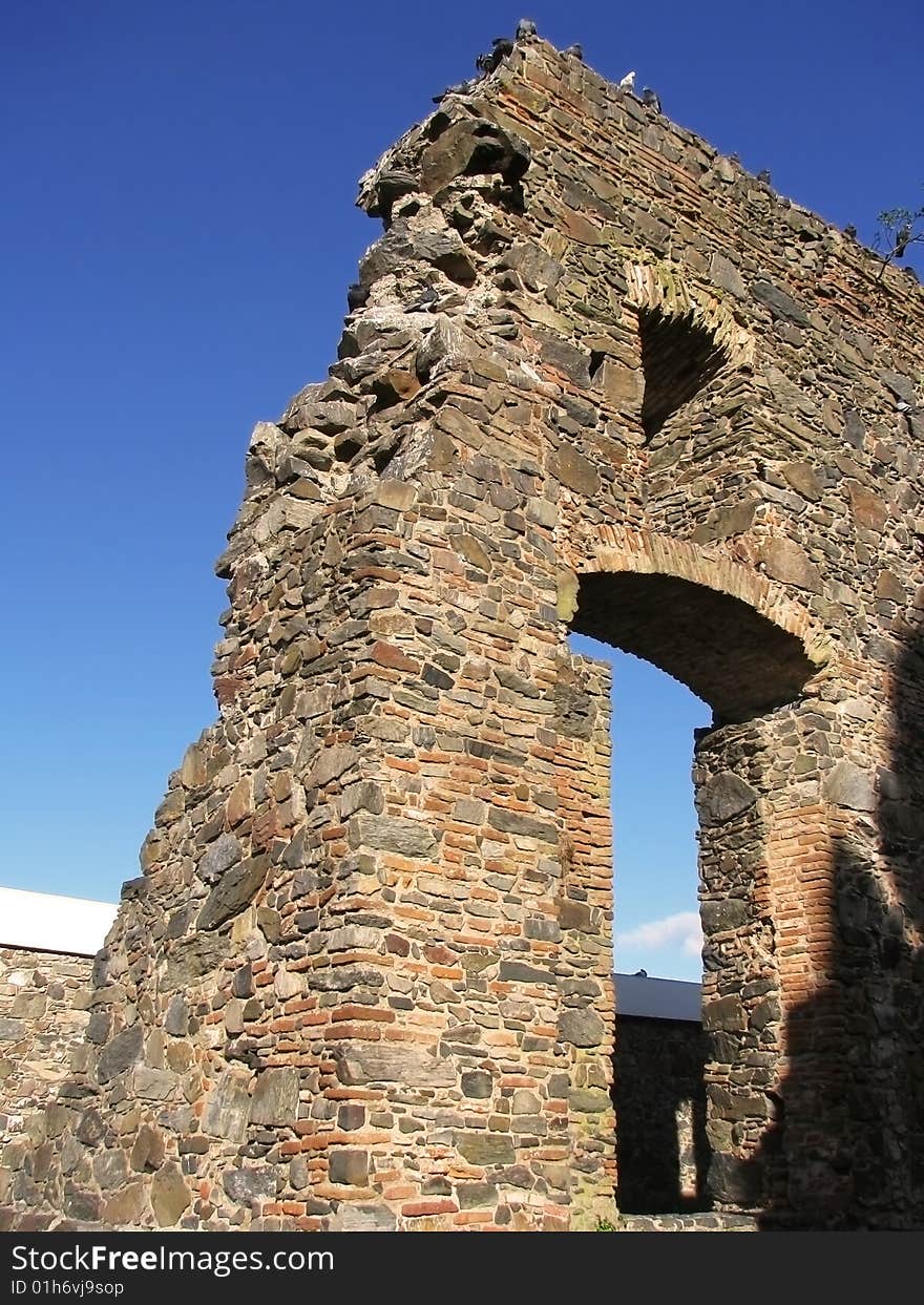 Ancient ruins against a blue sky.