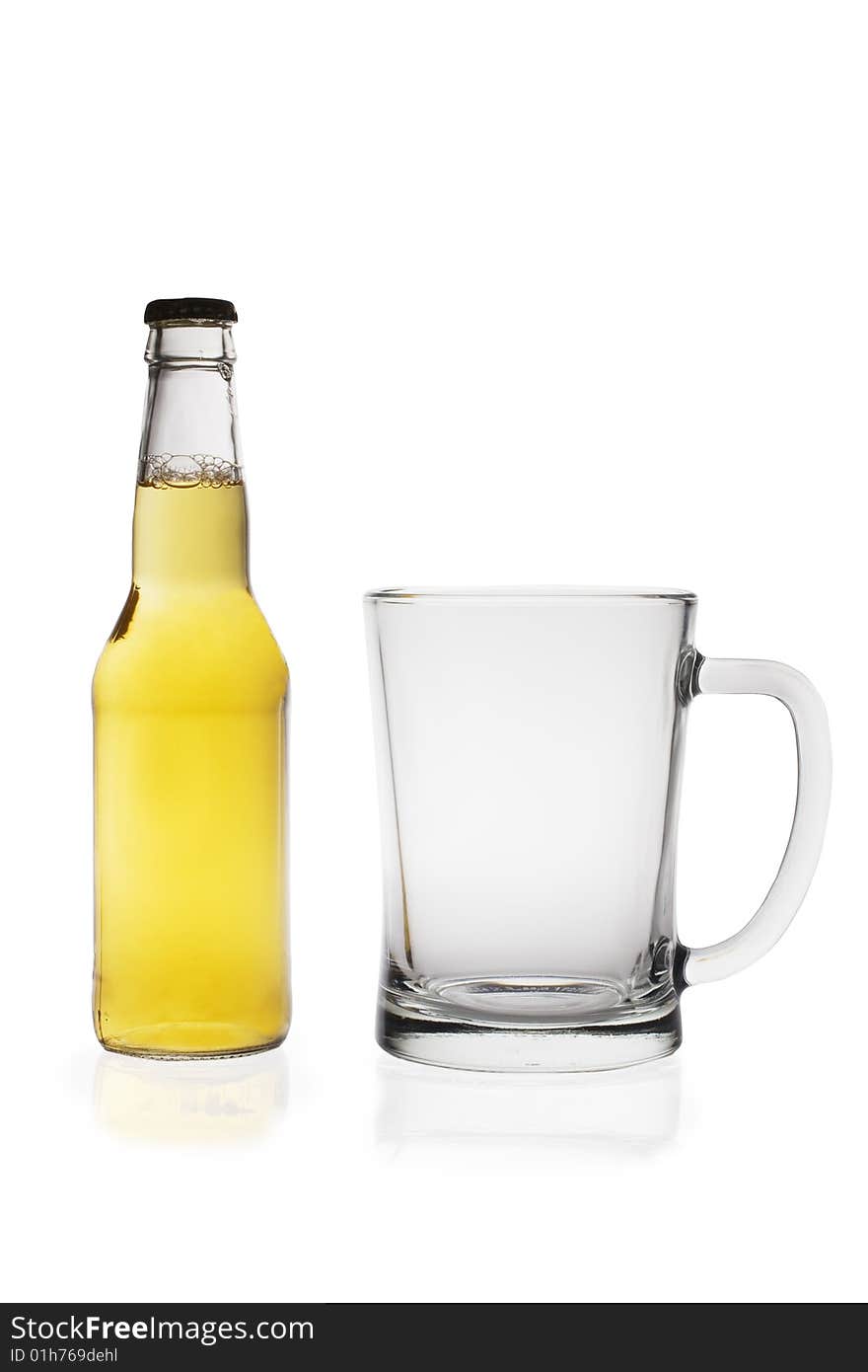 Beer bottle and glass isolated on white background