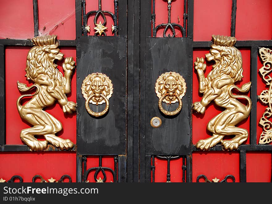 Double brass lions and lion face door knockers adorn the entrance gate to a farmhouse courtyard in Pengzhou, Sichuan Province, China - Lee Snider Photo. Double brass lions and lion face door knockers adorn the entrance gate to a farmhouse courtyard in Pengzhou, Sichuan Province, China - Lee Snider Photo.