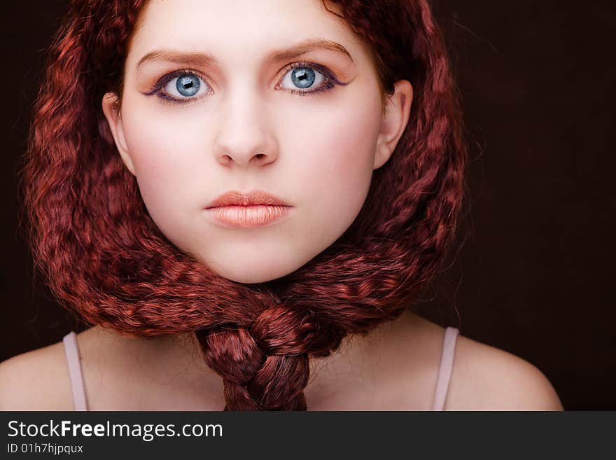 Pretty young girl with red tied hair