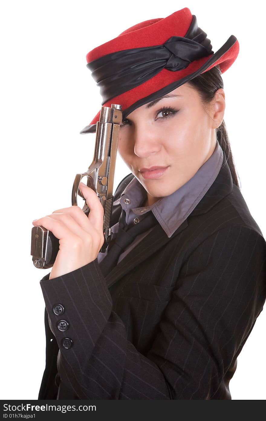 Attractive brunette woman with gun. over white background