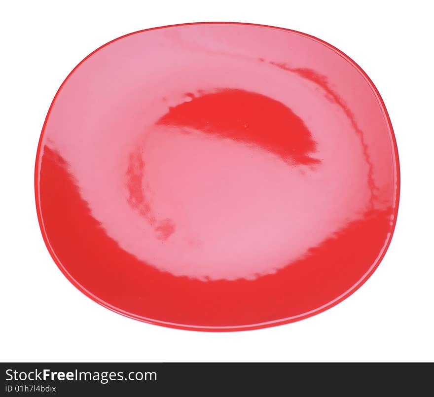 Red ceramic plate isolated on the white. Red ceramic plate isolated on the white.