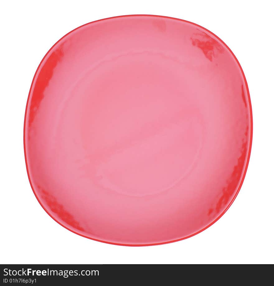 Red ceramic plate isolated on the white. Red ceramic plate isolated on the white.