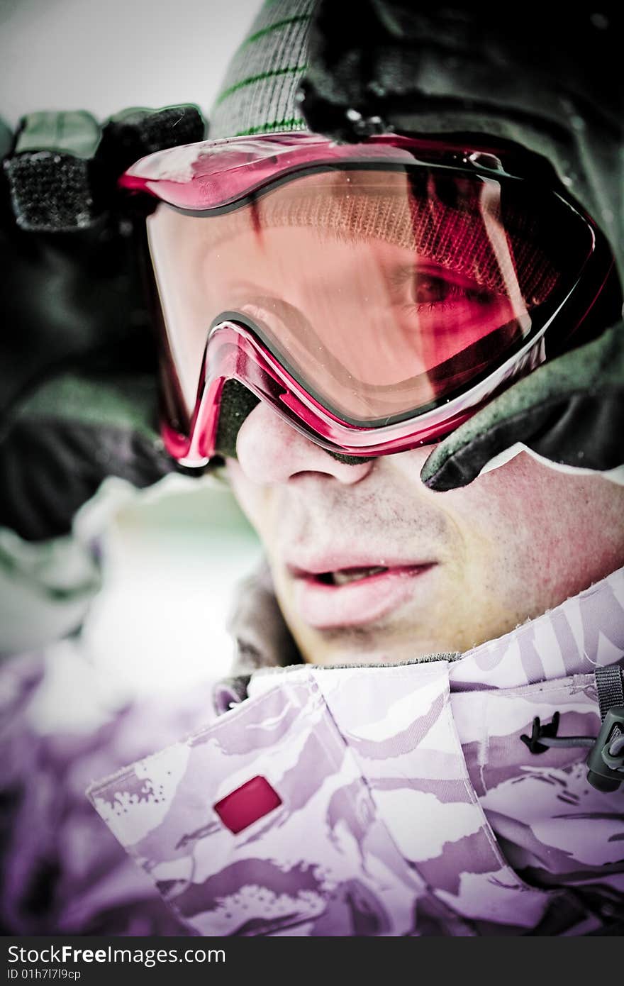 Snowboarder looking in goggles