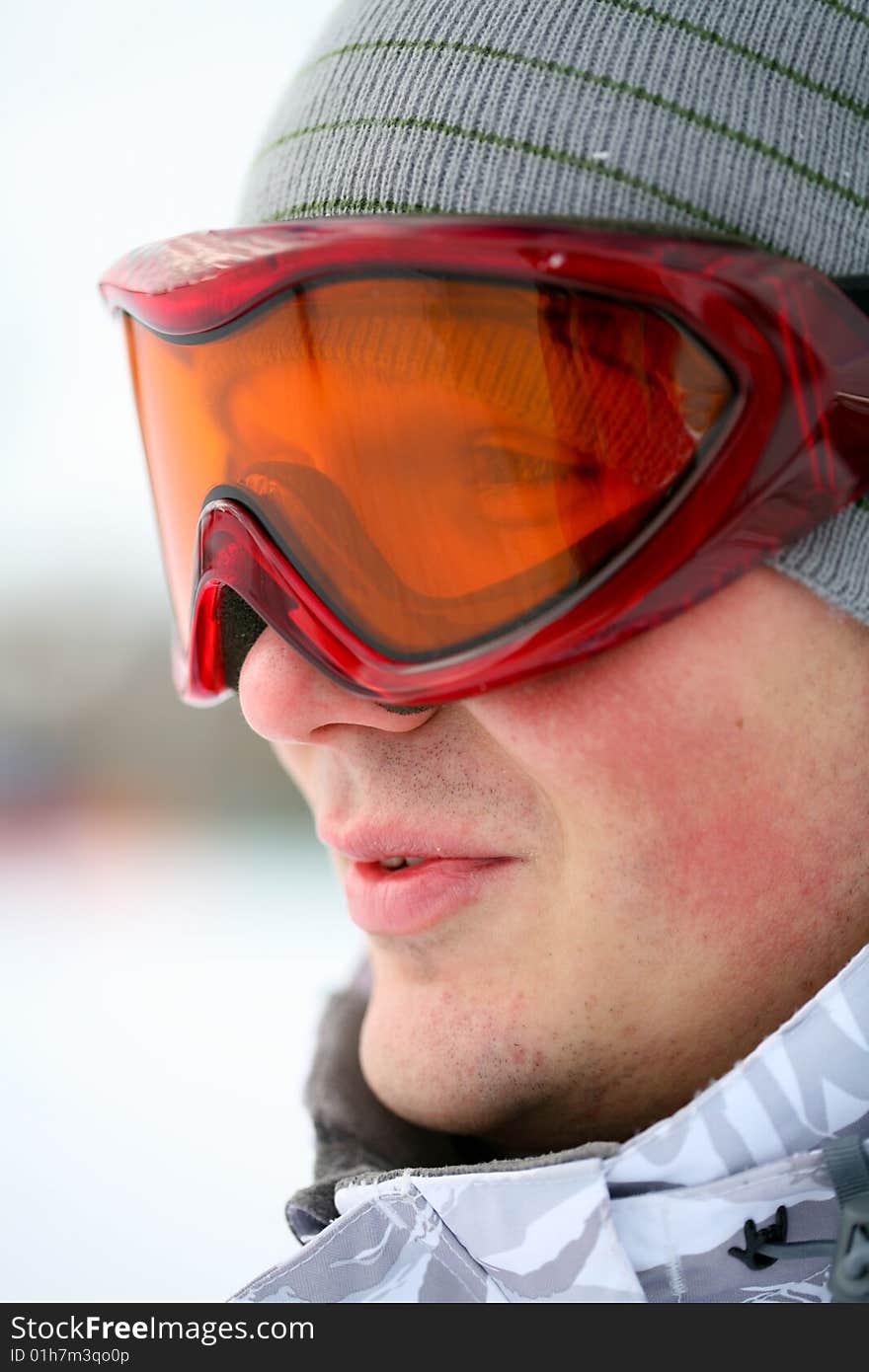 Snowboarder looking in goggles