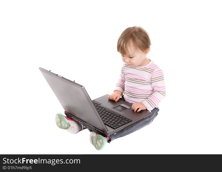 Sweet baby girl playing on laptop.over white background. Sweet baby girl playing on laptop.over white background