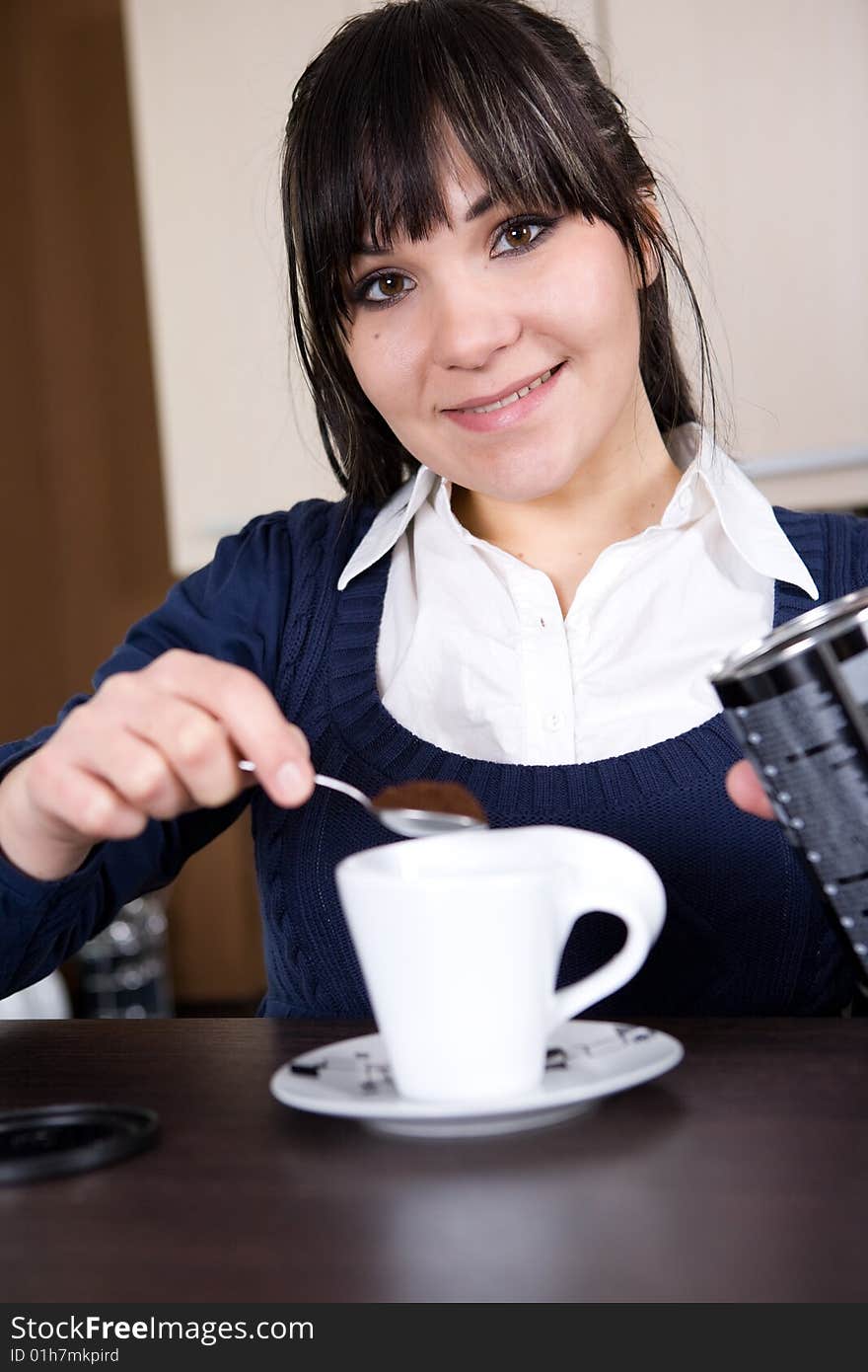 Woman making coffee at home. Woman making coffee at home