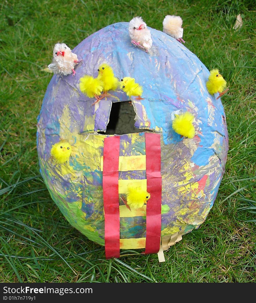 Â  paper easter egg with chicken in a sunny gardenÂ 