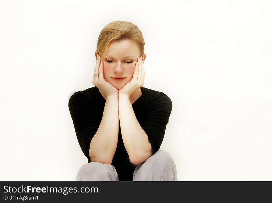 Tranquil woman looking down over white