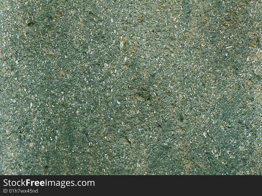 Pebble rock texture on green colors for background. Pebble rock texture on green colors for background