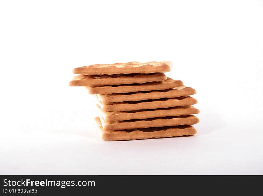 A stack of crackers on a white background. A stack of crackers on a white background.