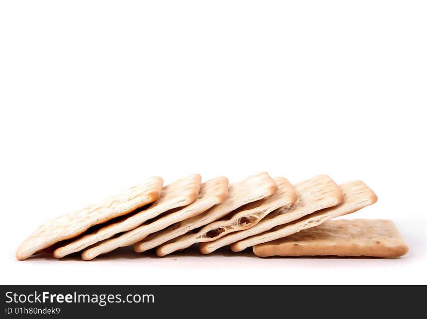 A stack of crackers on a white background. A stack of crackers on a white background.