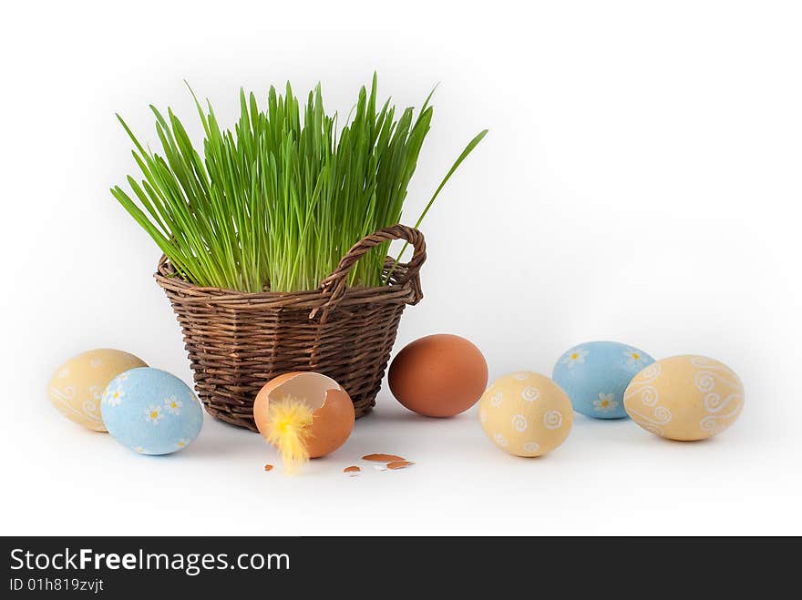 Easter eggs and basket with green grass. Easter eggs and basket with green grass