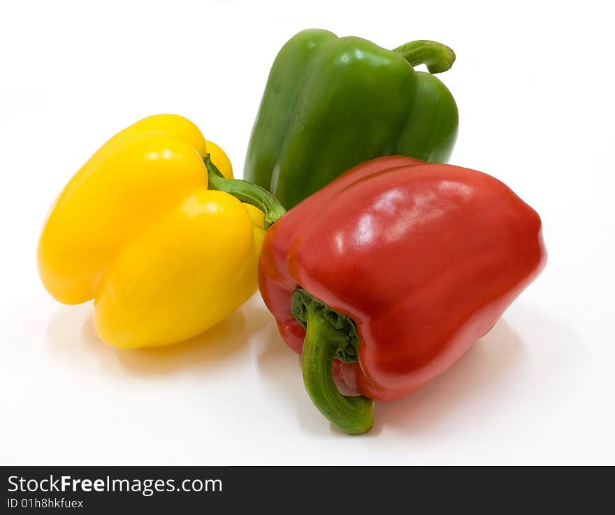 Isolated red, green and yellow paprika