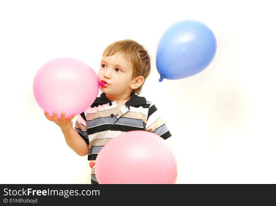 Toddler with balloons over white