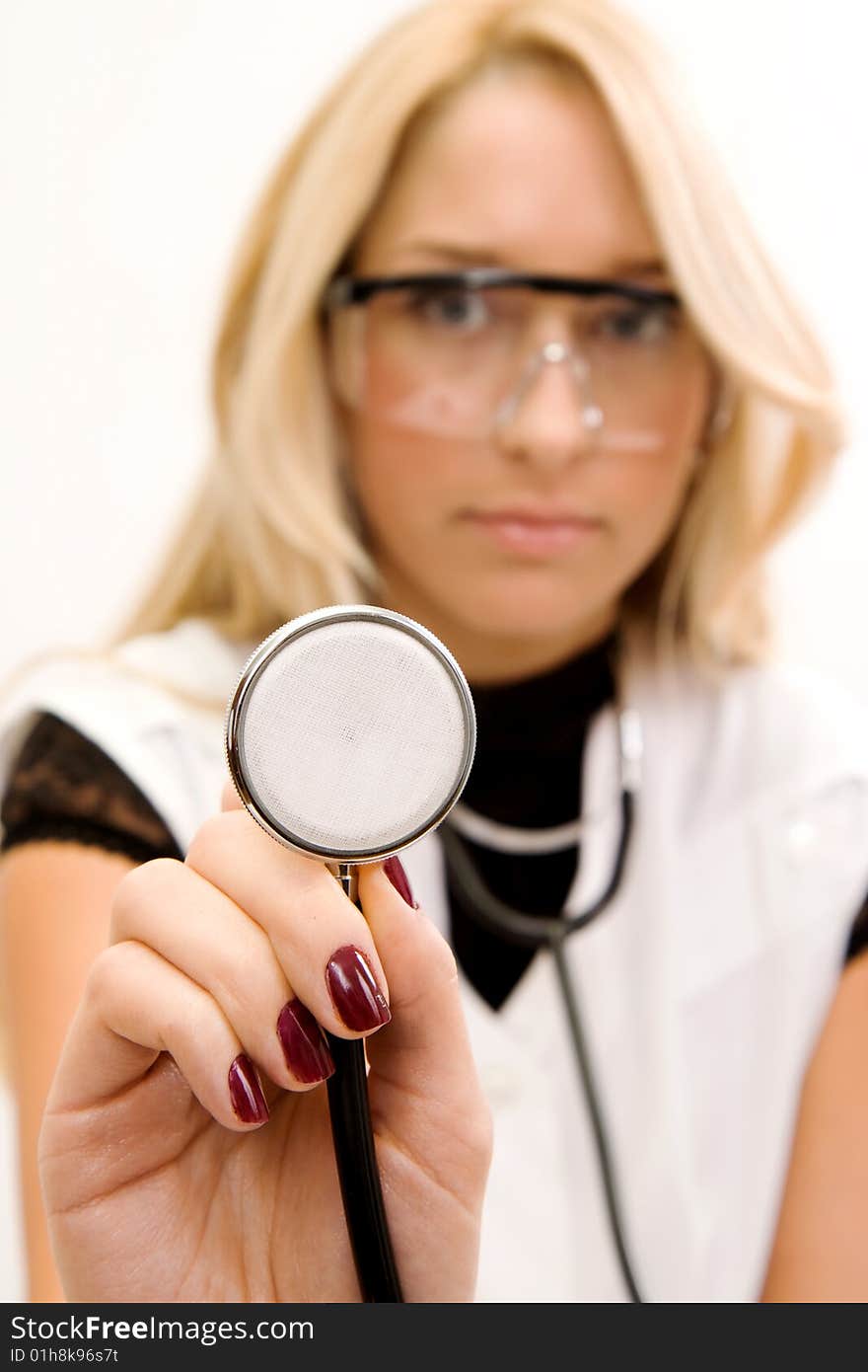 Young doctor with stethoscope isolated in white background