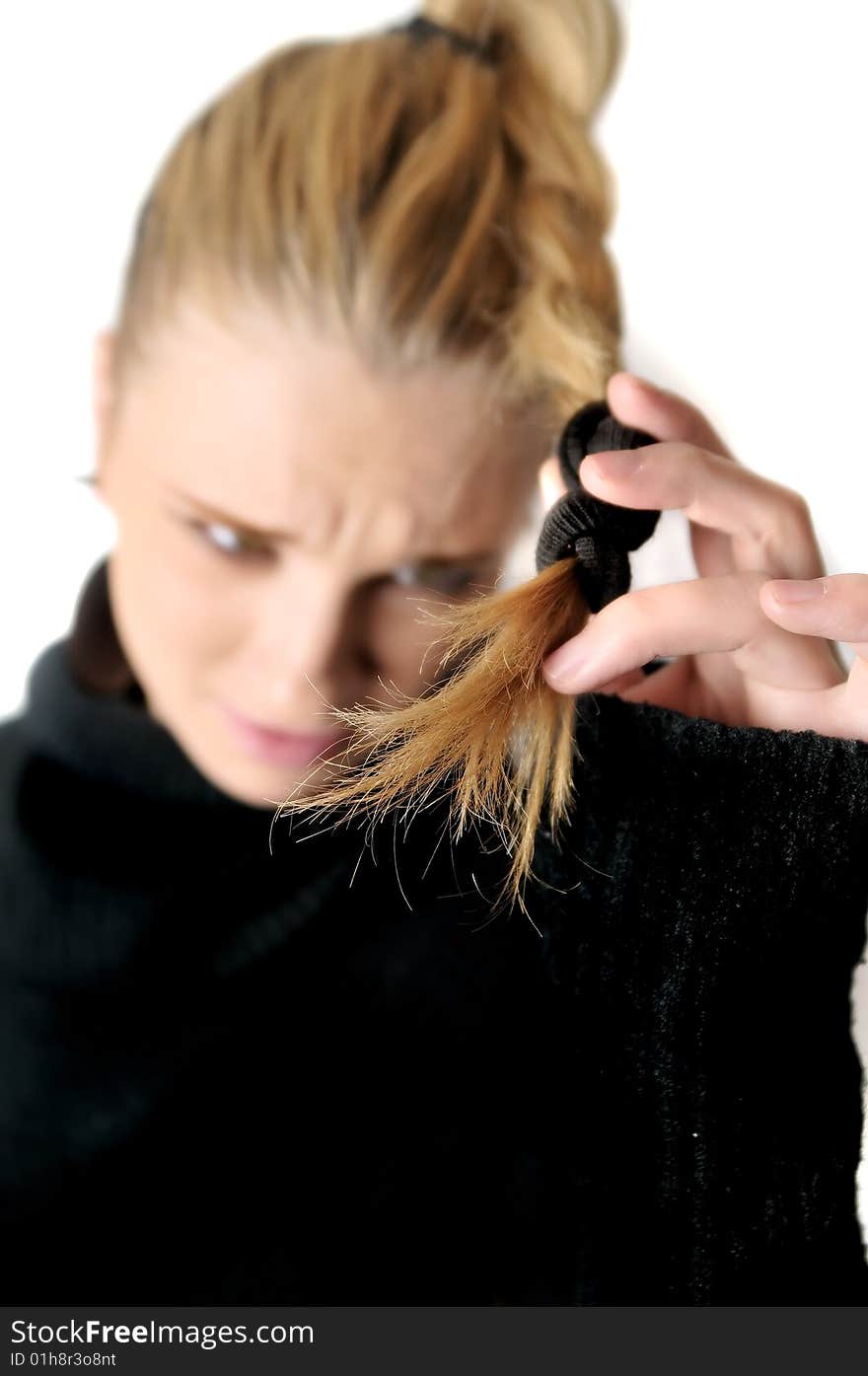 Girl is unsatisfied with the quality of hair. Girl is unsatisfied with the quality of hair