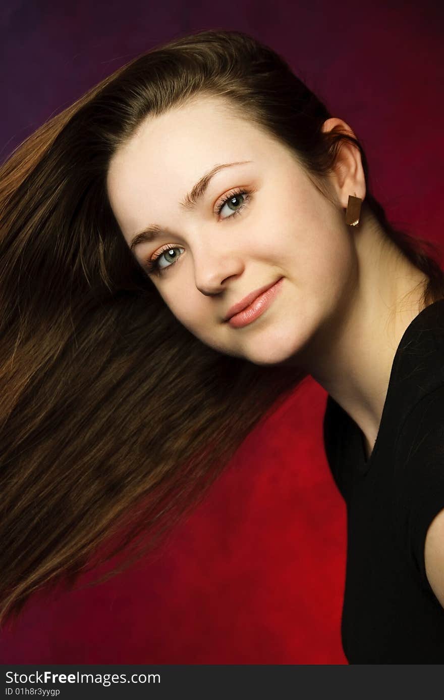 Studio portrait of an attractive woman with beautiful long hair. Studio portrait of an attractive woman with beautiful long hair