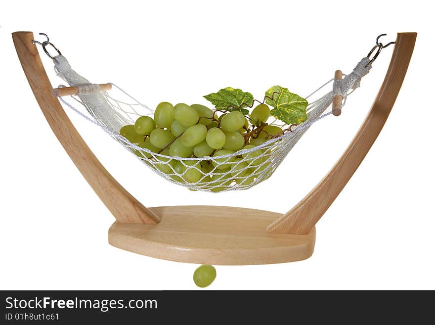 Ripe Green grapes with leaves, in a vase in hammock form