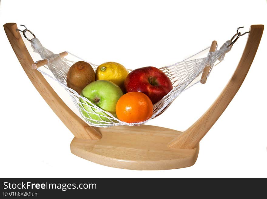 Fruits in hammock: kiwi, apples, lemon an mandarin