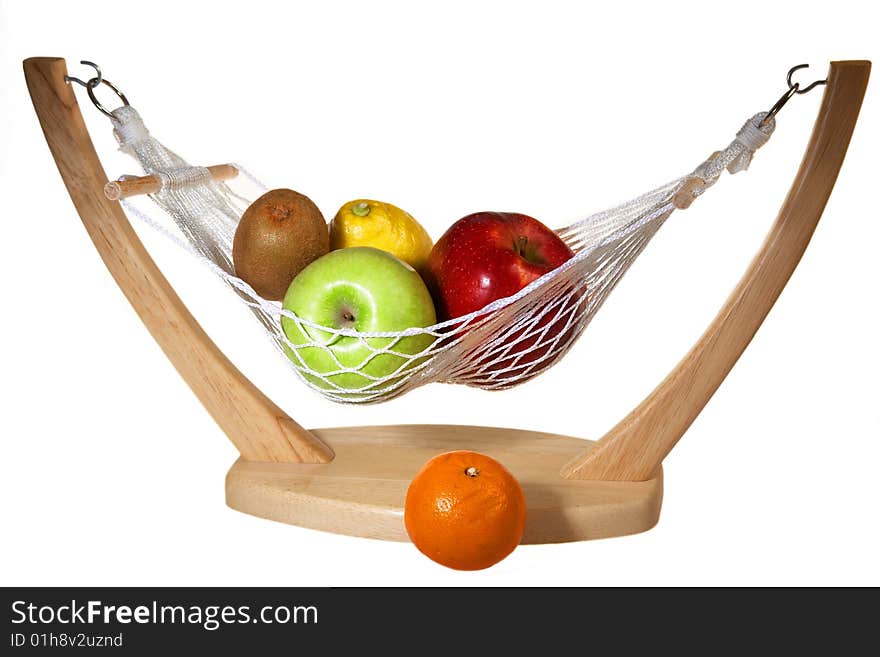 Fruits in hammock: kiwi, apples, lemon an mandarin