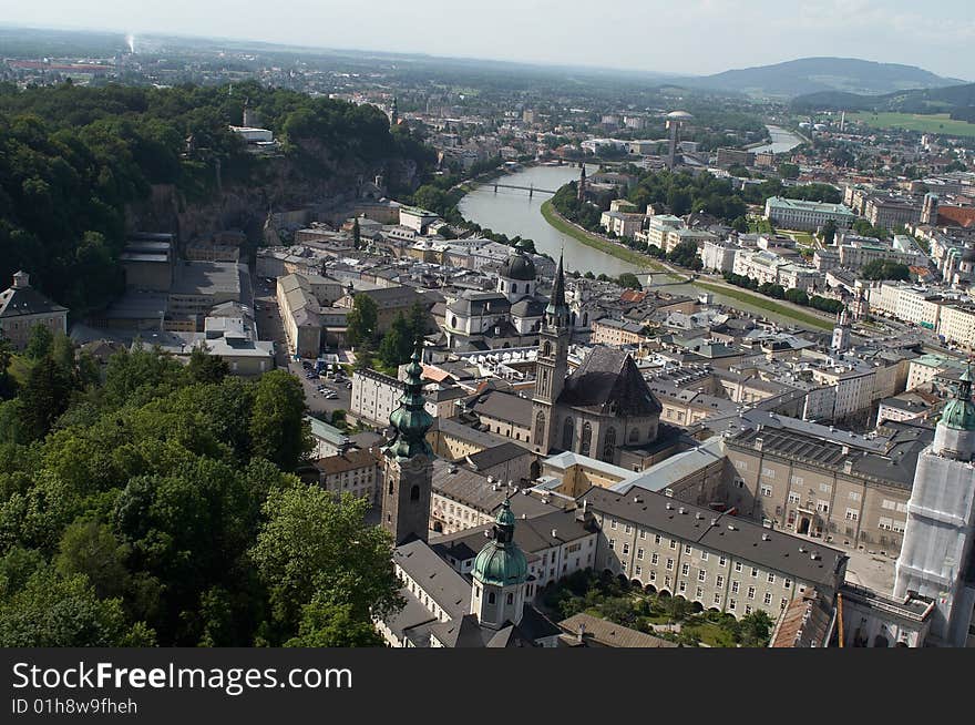 Cityscape shows Salzburg with river going across it, tilted horizon adds dynamics to the scenery. Cityscape shows Salzburg with river going across it, tilted horizon adds dynamics to the scenery