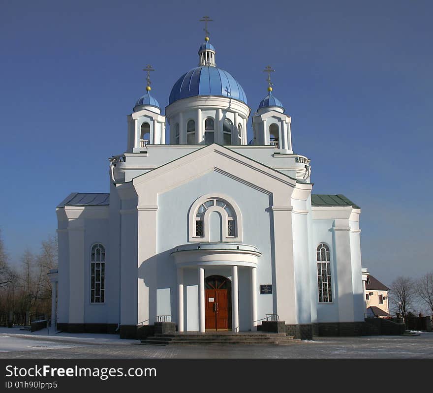 Light blue orthodox church and blue sky