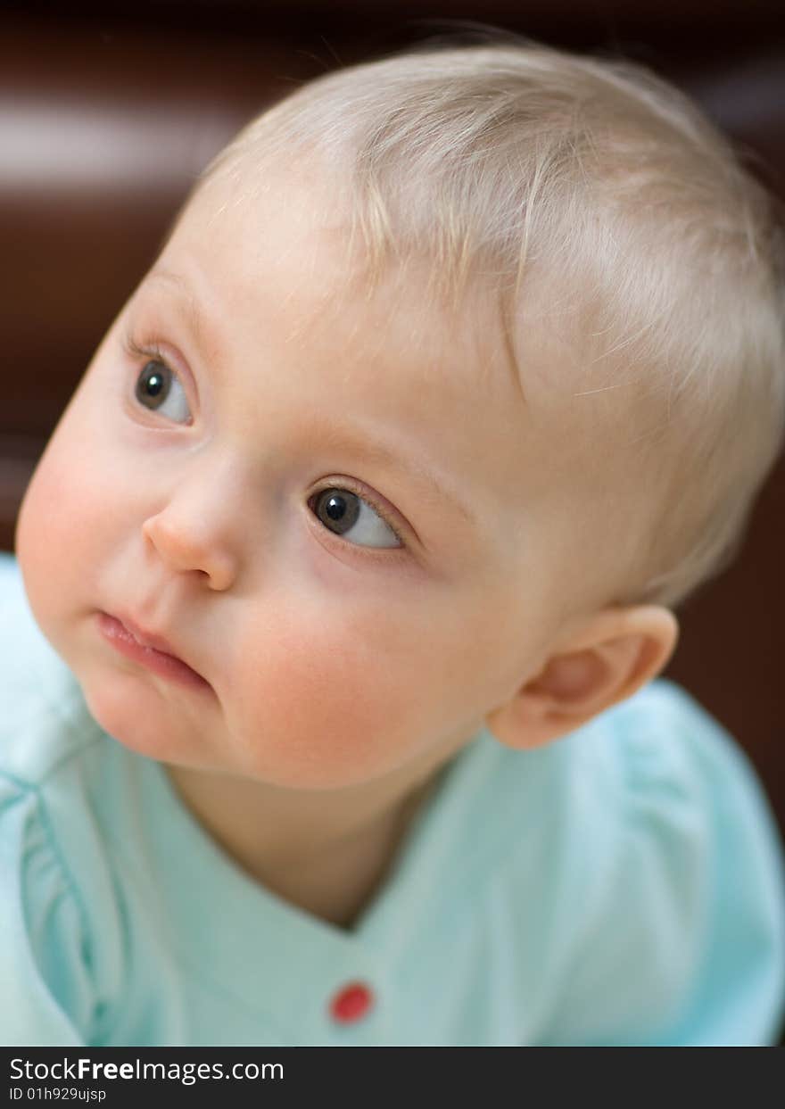 Serious adorable baby close-up - shallow DOF