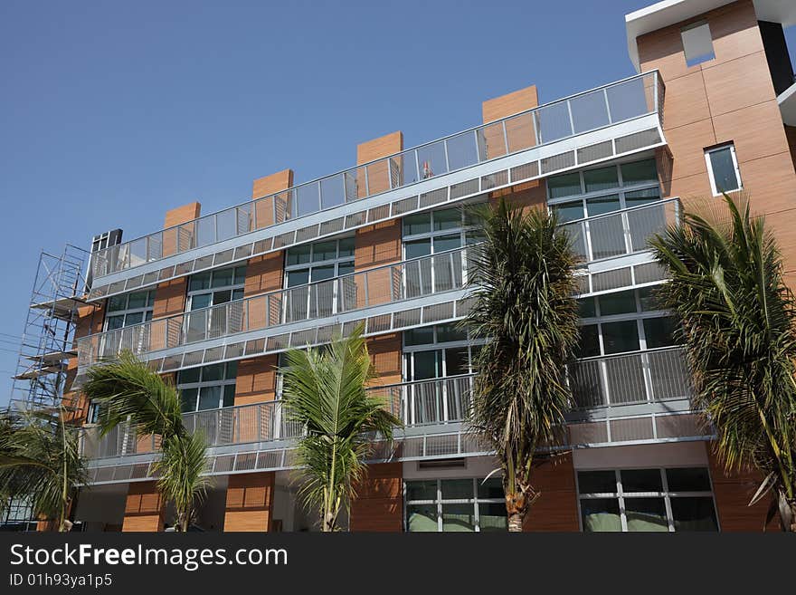 Beautiful modern apartment building on a clear blue sky. Beautiful modern apartment building on a clear blue sky