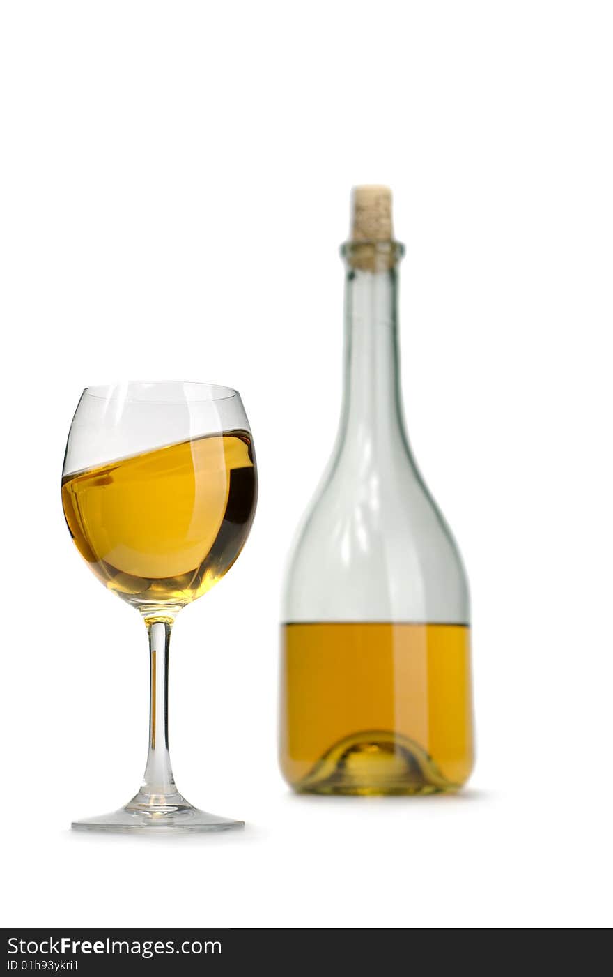 Glass and bottle of excellent white wine on a white background