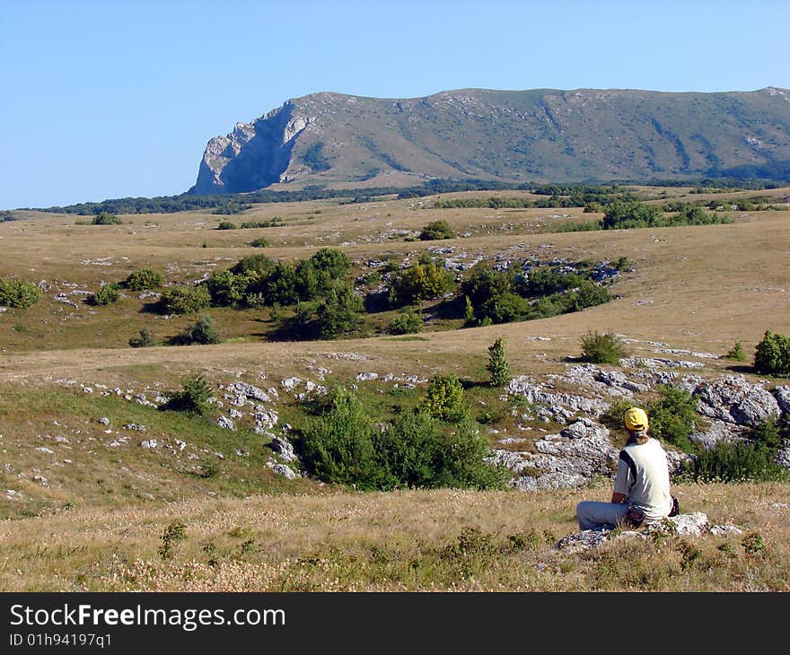 Ukraine, Crimea, Chatirdag mountain. Tourist on the Chatirdag plateau. Ukraine, Crimea, Chatirdag mountain. Tourist on the Chatirdag plateau.