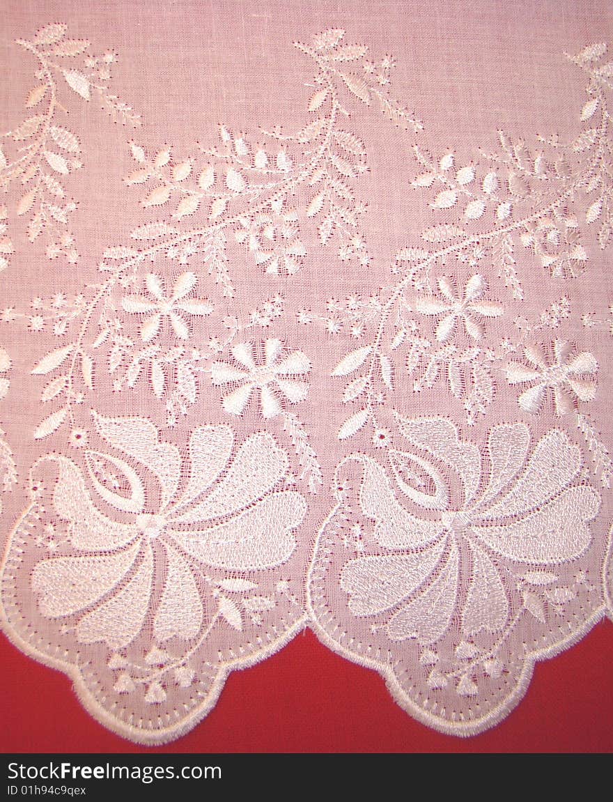 Embroidery rishelye on a white batic