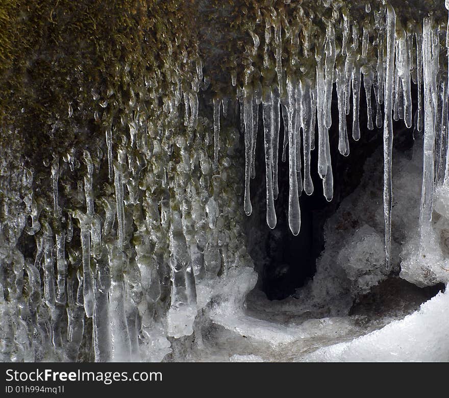 Frozen creek and icicles