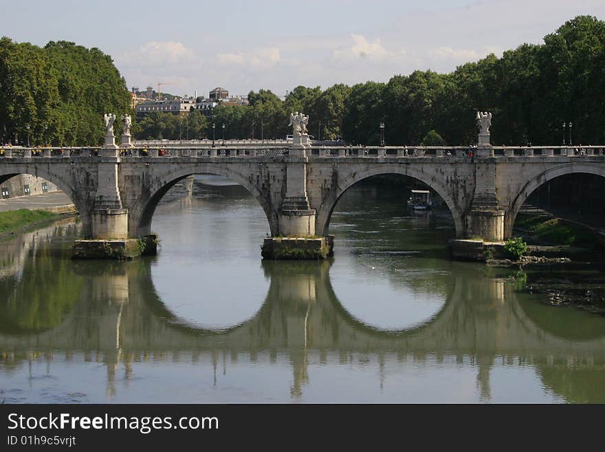 Bridge to cross to the vatican in Rome. calm and still river. Bridge to cross to the vatican in Rome. calm and still river.