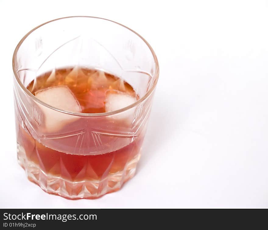 Glass of whiskey 	
photograph in the foreground