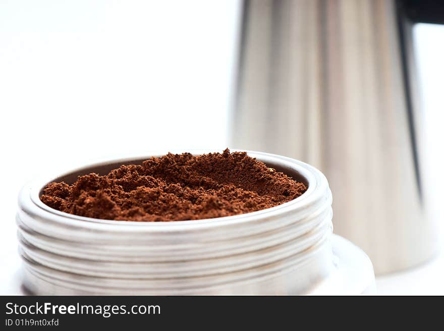 Some coffee in coffeepot on white background