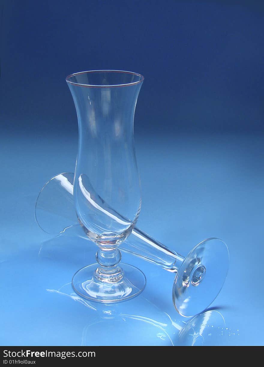 Two glasses on blue