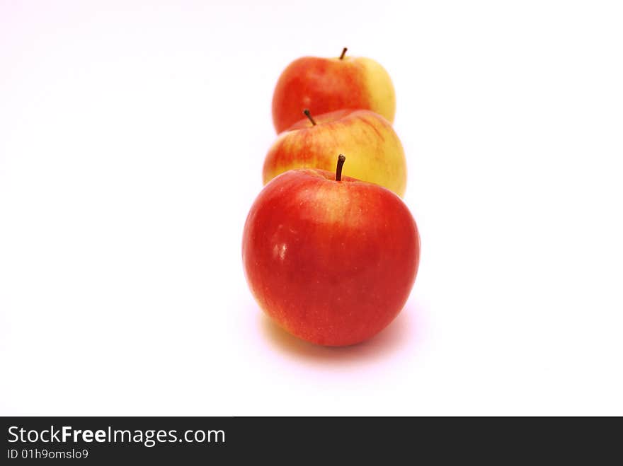 Three red apples on a white background. Three red apples on a white background