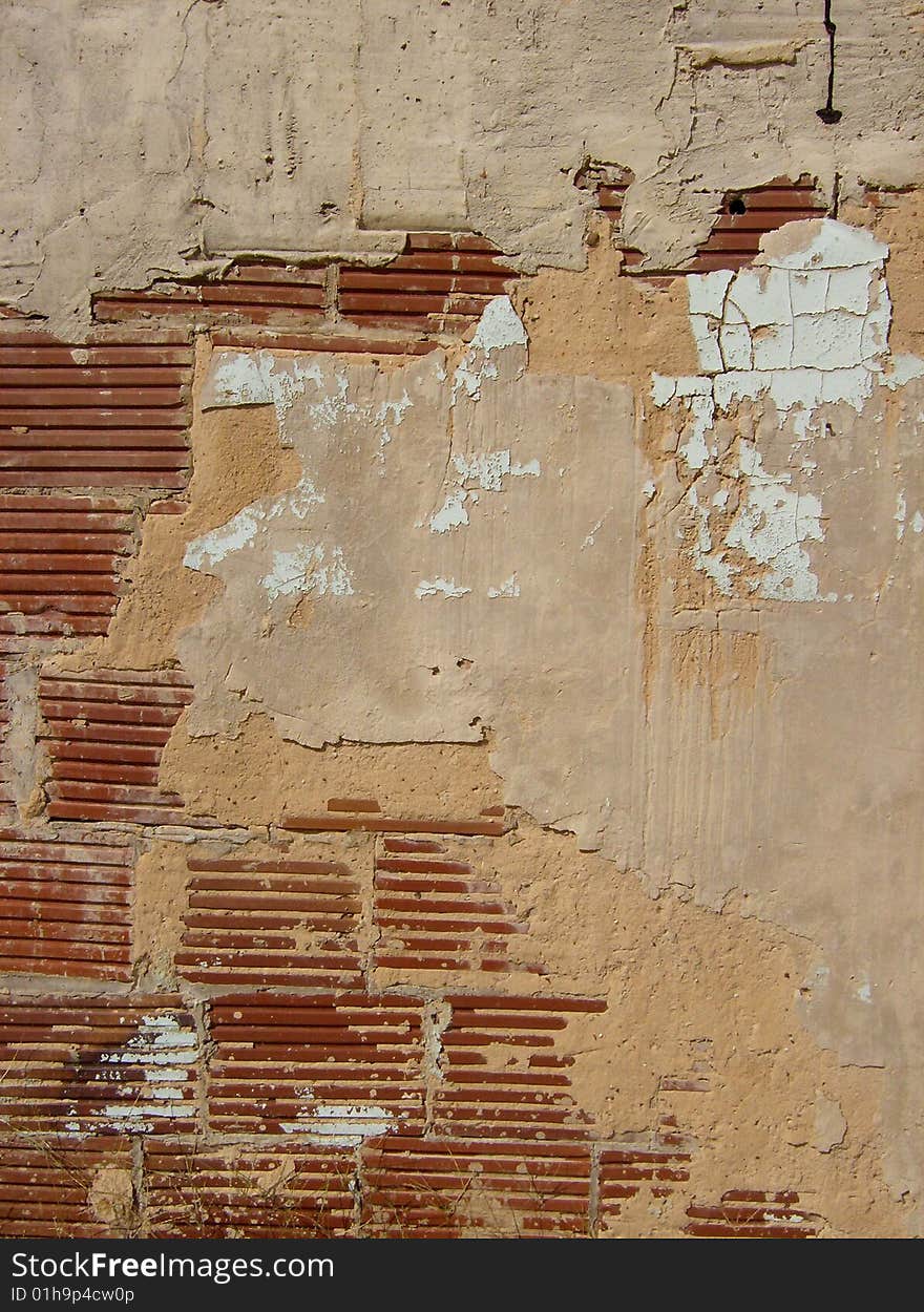 Worn brick wall, peeling paint. Worn brick wall, peeling paint